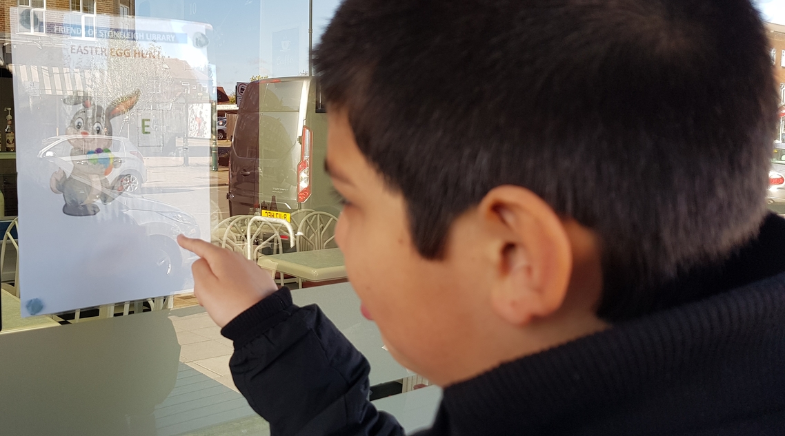 Boy pointing at Easter Poster 2022