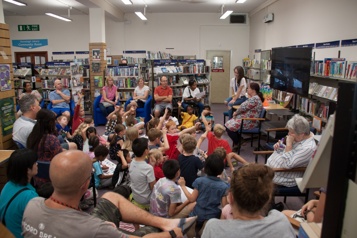 Crowd in library for the SRC 2019 Party