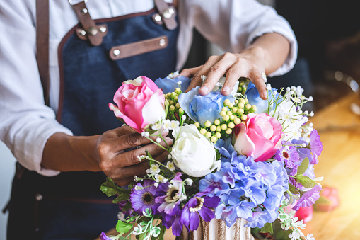 Woman arranging flowers