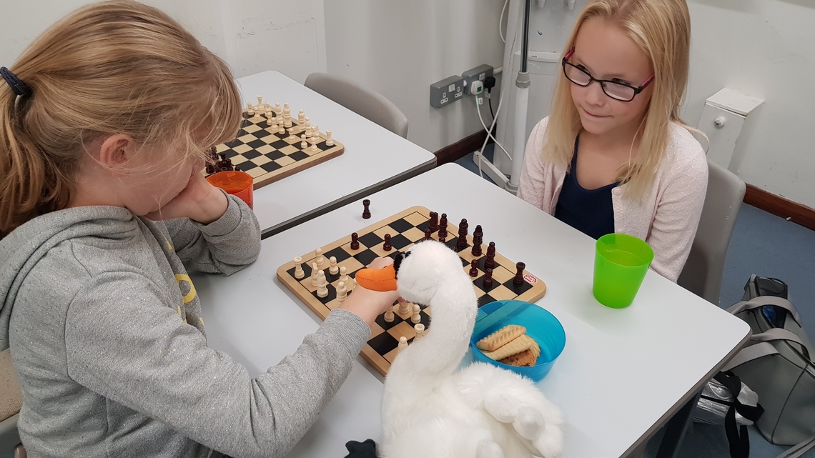 Two Girls Playing Chess
